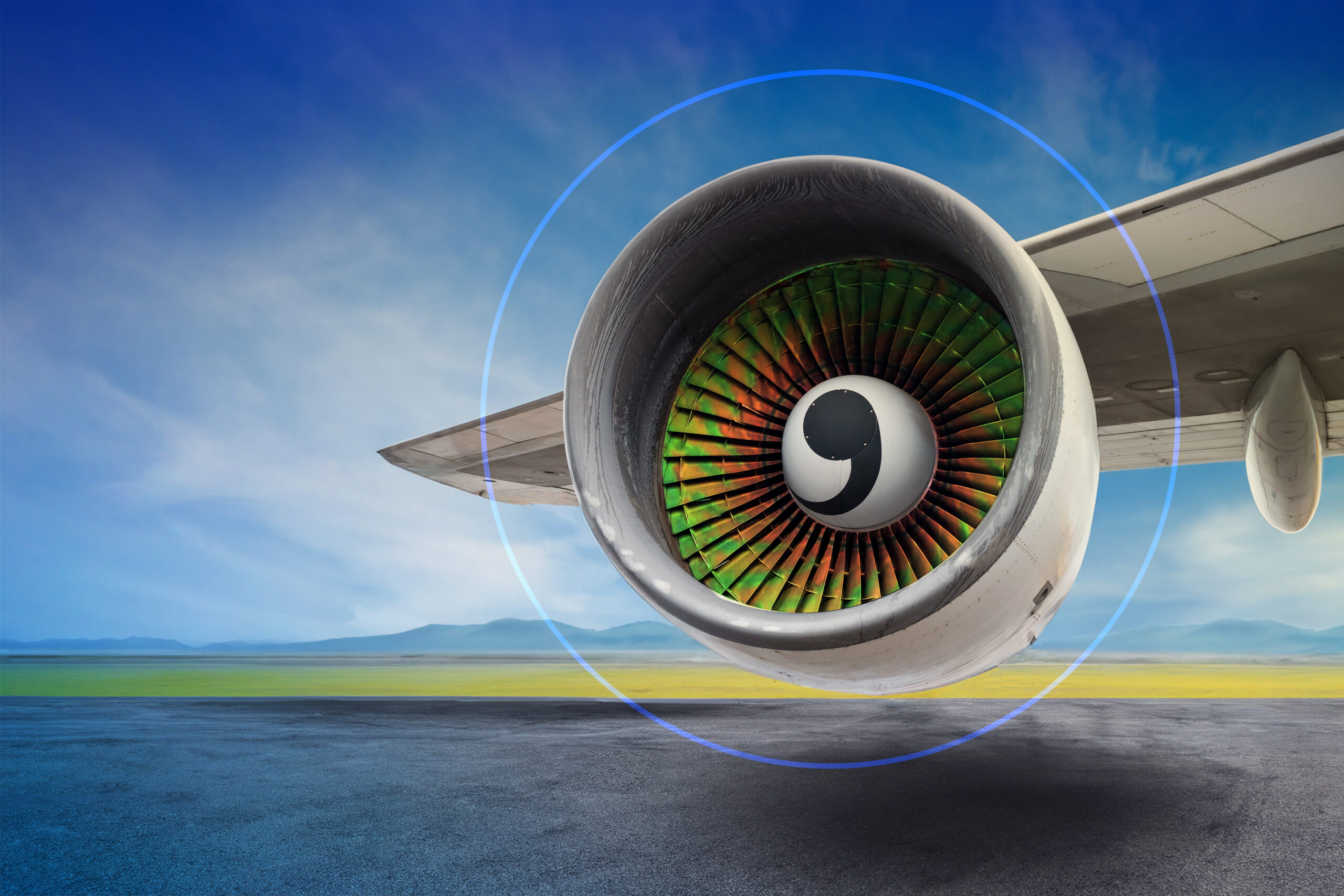 under a big jet plane turbine reactor , blue cloudy sky background